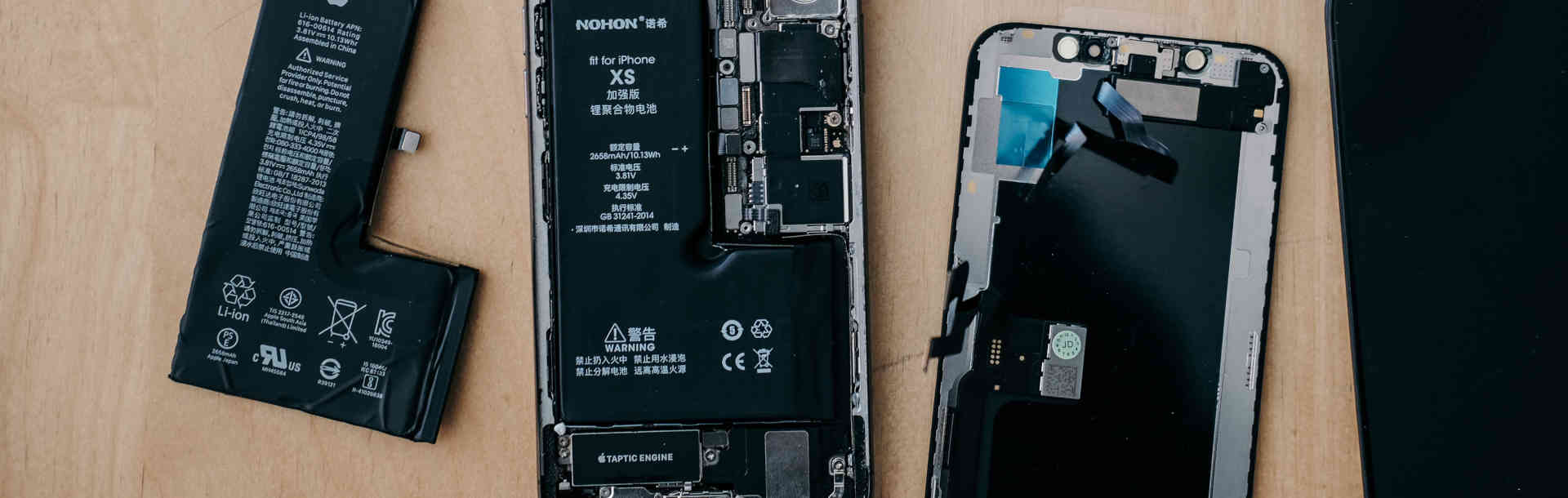 Disassembled smartphone components ready for recycling streams